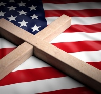 Symbolbild: Christliches Kreuz auf der US-Flagge.